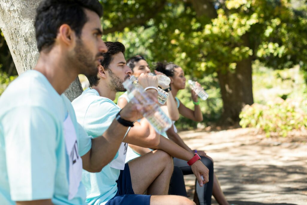 Marathon athletes having water